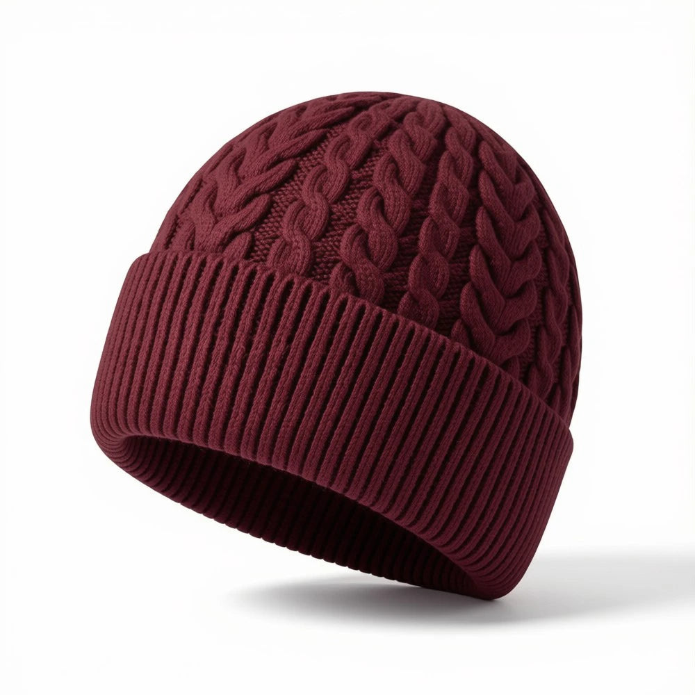 Burgundy cable knit beanie with ribbed cuff and classic textured pattern.