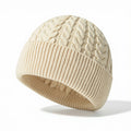 White cable knit beanie with ribbed cuff and classic textured pattern.
