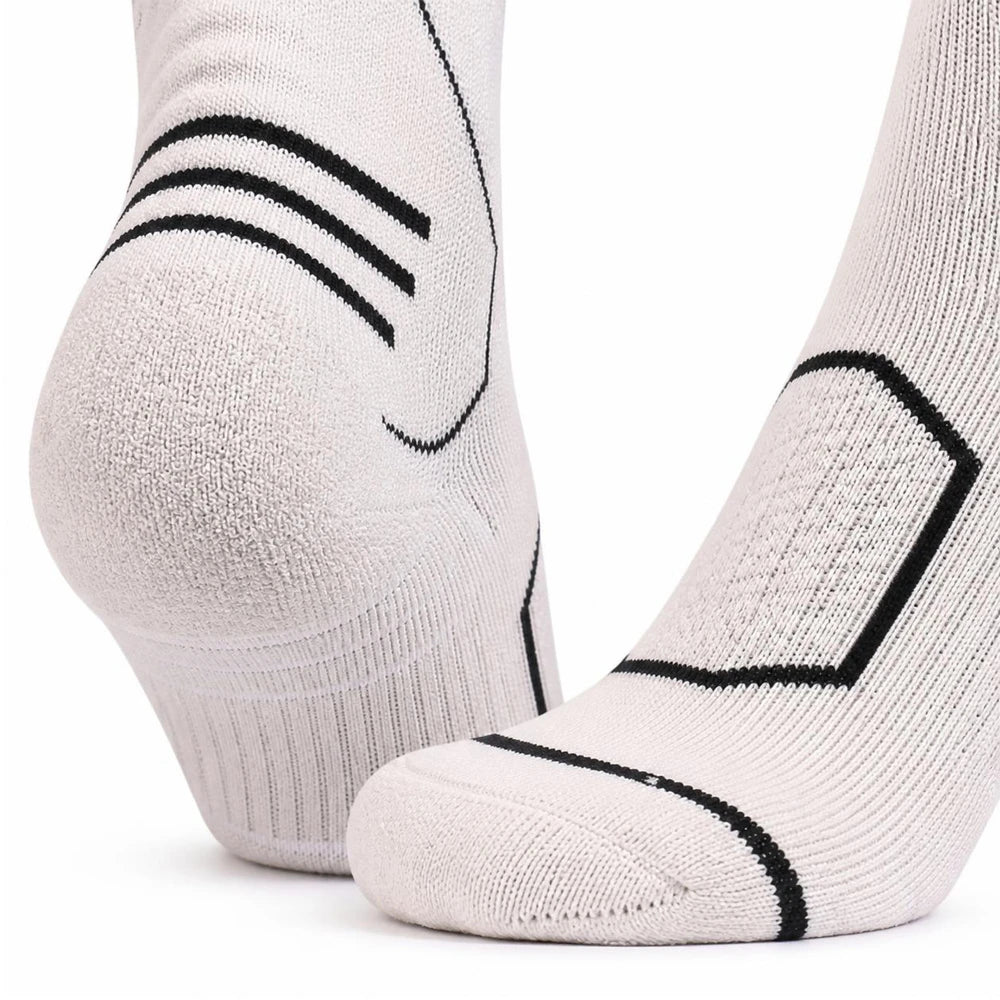 Close-up of the seamless toe and reinforced heel on white Merino blend ski socks.