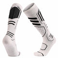 White Merino blend ski socks showing the front and back in a V-shape.