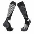 Black and grey merino wool ski socks with ribbed cuff and cushioned sole.