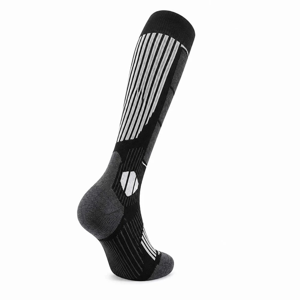 Side view of black merino wool ski socks showing knee-high length and arch support.