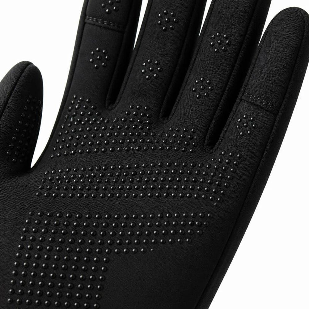 Close-up of the silicone anti-slip dot pattern on the palm of black winter cycling gloves.